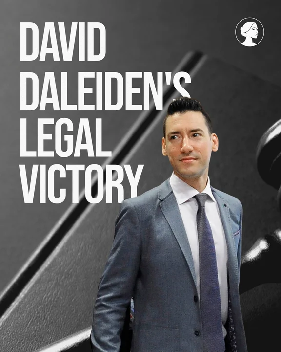 A man in a suit stands before large text reading Daleiden Victory, with a blurred gavel in the background and a small logo of a woman's profile in the top right corner.