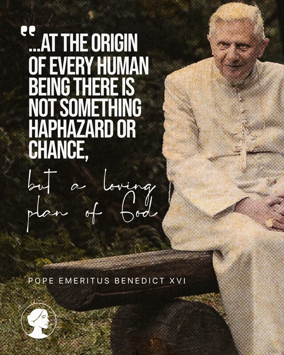 An elderly Pope Emeritus Benedict XVI, dressed in white, sits on a wooden bench outdoors. A quote beside him reads: ...At the origin of every human being there is not something haphazard or chance, but a loving plan of God.