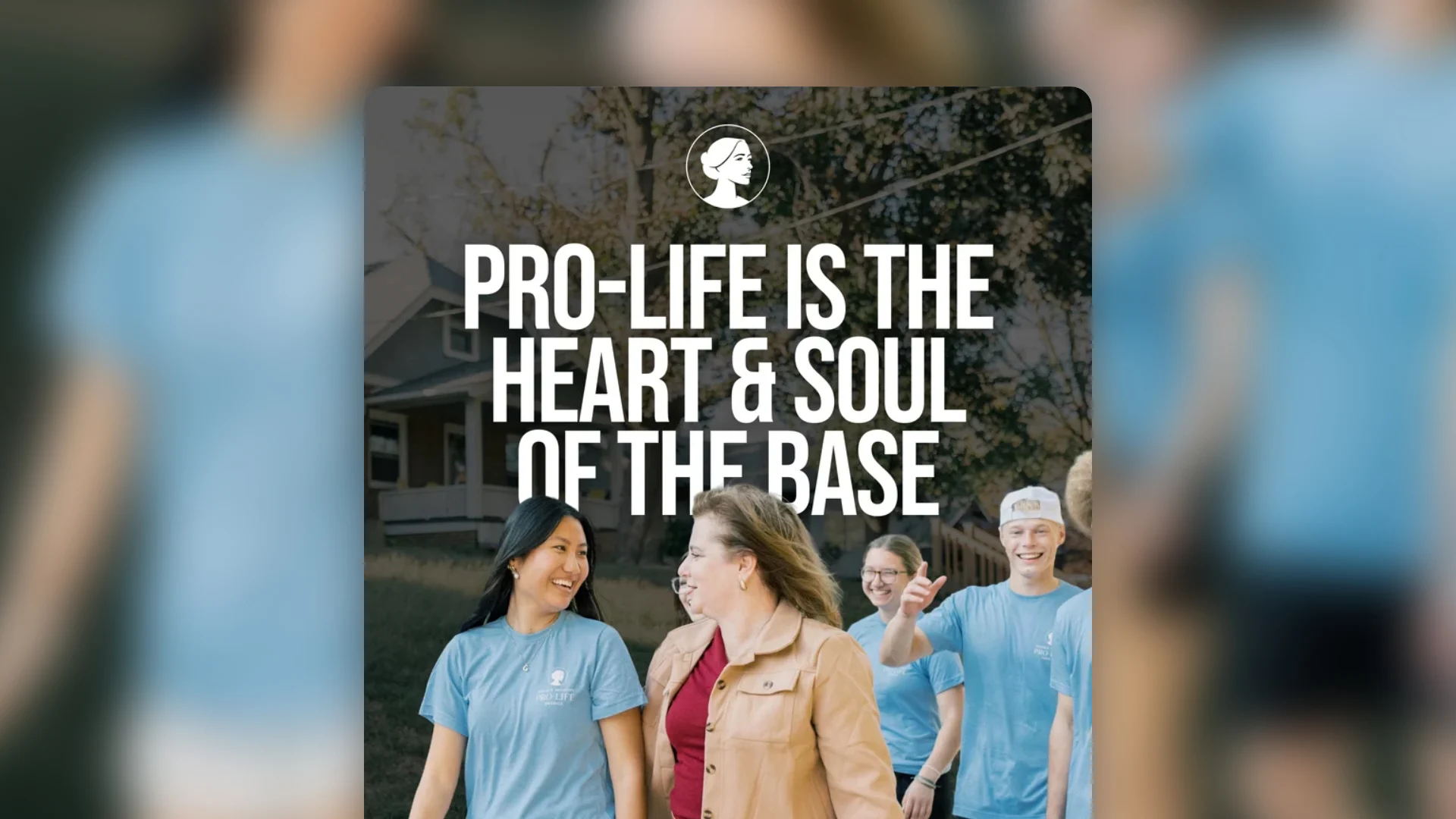 A group of people outdoors, some wearing blue shirts, walk and smile. Large text over the image reads, PRO-LIFE IS THE HEART & SOUL OF THE BASE.