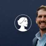 A man in a blue suit smiles in front of a dark blue textured background with a white silhouette of a woman's profile inside a circle, representing TX-38 pro-life advocate Jon Bonck.
