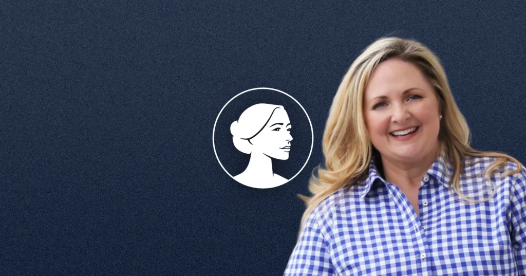 A smiling woman with long blonde hair, wearing a blue and white checkered shirt, stands in front of a dark blue background featuring a white outlined profile of a woman’s face in a circle—Tricia Pridemore, GA-11’s Pro-Life advocate.