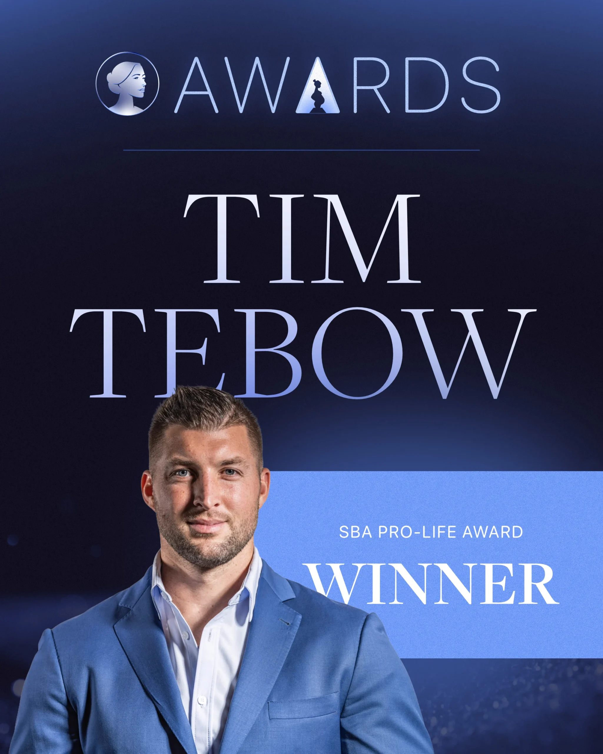 A man in a blue suit stands in front of a graphic reading Awards, Tim Tebow, SBA Life Awards, and Winner on a dark blue background.
