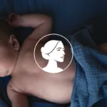 A newborn baby lies on a soft blue blanket, covered partially with a blue cloth. An illustrated woman's profile in a white circle is centered over the baby's chest, symbolizing the commitment to Protect Unborn Children.
