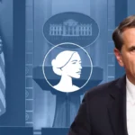 A man in a suit speaks at a podium with a microphone. Behind him are the American flag, a White House emblem, and an illustrated profile of a woman on a blue backdrop, as he addresses the abortion drug lawsuit supported by pro-life groups.