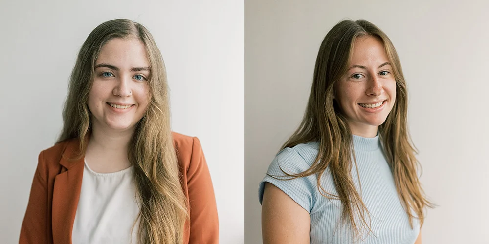 Two women with long brown hair smile at the camera against a plain, light background. The woman on the left, one of the SBA Interns, wears a rust blazer; the woman on the right wears a light blue top. Their expressions reflect positivity and camaraderie amid today’s dynamic political climate.