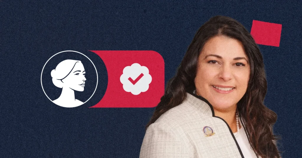 A woman in a light blazer smiles in front of a dark blue background with a graphic of a female profile, a check mark, and red geometric shapes, symbolizing Rodriguez-Williams’s commitment to Pro-Life values and leadership as WY SOS.