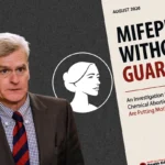 A man in a suit stands next to a report titled Mifepristone Without Guardrails, which discusses risks of abortion drugs. The cover includes a profile illustration of a woman and highlights concerns for mothers and babies, emphasizing the importance of safety protocols in the use of medications such as the Cassidy Abortion Drug.