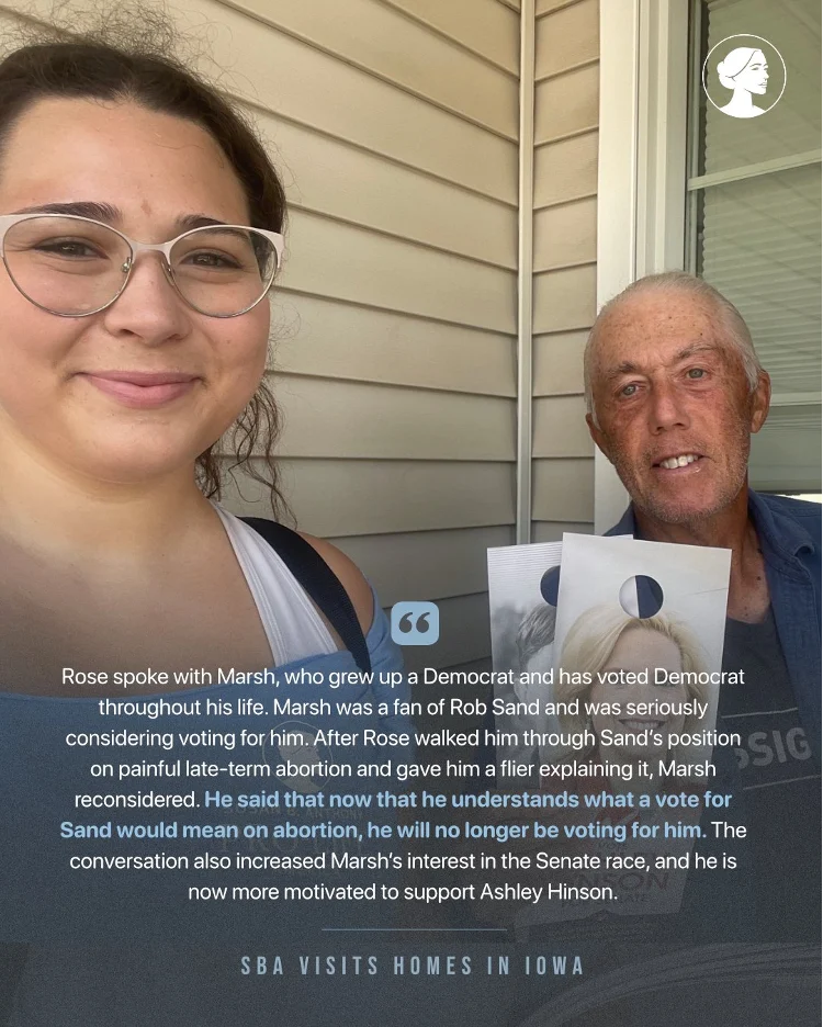 Two people stand smiling for a selfie. The younger woman holds campaign materials. Text below describes a conversation about voting and abortion issues, highlighting how the abortion narrative is shaping discussions during SBAs visit to homes in Iowa ahead of the midterms.