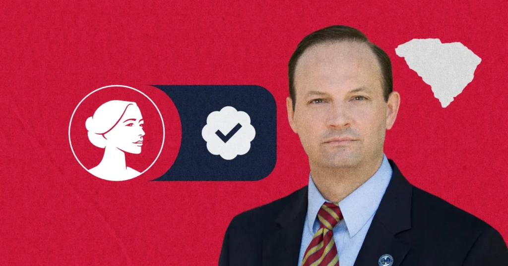 A man in a suit stands in front of a red background with a South Carolina outline, a profile of a woman, and a checkmark in a dark blue box, symbolizing Pro-Life values and SC Governor candidate Alan Wilson’s campaign.