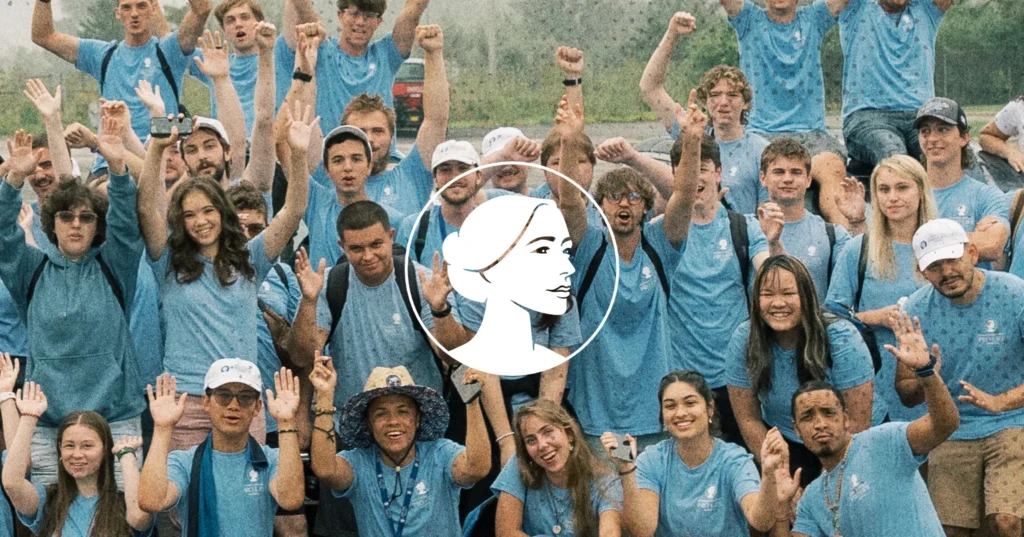 A large group of young adult pro-life battleground voters wearing matching blue t-shirts wave and smile at the camera, overlaid with a circular icon of a stylized woman’s profile.